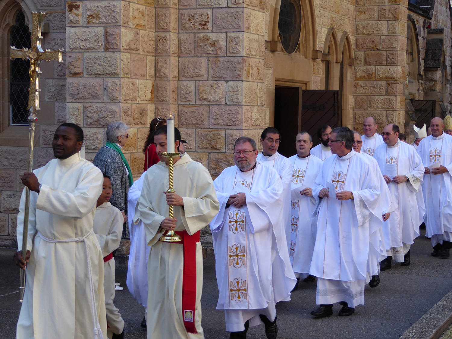Priests and altar servers outside the Cathedral before the entrance procession, led by Holy Spirit seminarian, Humphrey Obasi