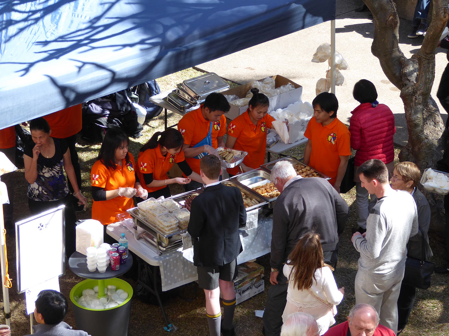 The Vietnamese Eucharistic Youth Movement serves handmade Vietnamese food at the MacKillop Day morning tea, Cathedral of St Stephen 2015